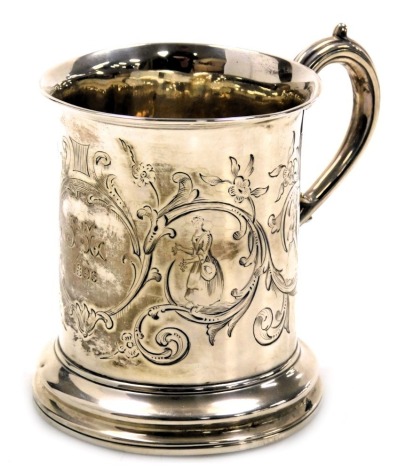 A Victorian silver tankard, with figural and foliate engraved decoration, central reserve, monogram engraved and dated 1896, London 1844, 4.62oz.