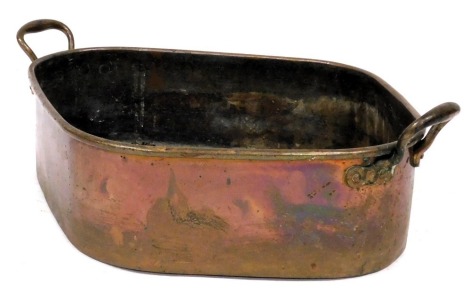 A 19thC copper twin handled roasting pan, engraved with the letter I, beneath an Earl's coronet, number 22 to handle, 66cm wide, 47cm deep.