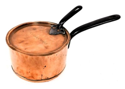 A 19thC copper saucepan, with lid, with cast iron handle, stamped E Thomas & Company Oswestry, the lid engraved for Chirk Castle, 15cm wide. (AF)