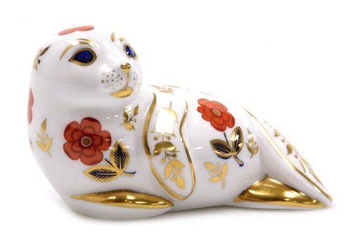 A Royal Crown Derby Imari paperweight modelled as a seal pup, gold stopper, 12cm wide.