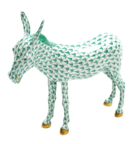 A Herend porcelain figure of a donkey, with a green scale ground, painted marks, 18cm wide.