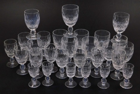 A suite of Waterford Crystal Colleen pattern glassware, comprising six white wine glasses, seven port glasses, eight sherry glasses and six liqueur glasses.