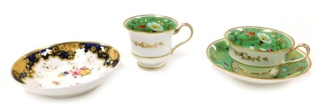 An early 19thC porcelain trio, painted with flowers, gilt heightened, against a pale green ground, comprising tea cup, coffee cup and saucer, and a Ridgways saucer painted with floral sprigs. (4)