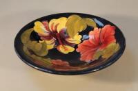 A Moorcroft pottery circular 'hibiscus' pattern dish