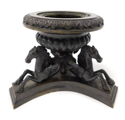 A 19thC bronze censer, of semi fluted urn form, above three Hippocampus, raised on a tri form base, 15cm wide.