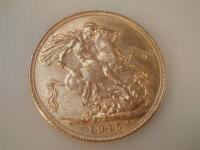 A George V gold sovereign dated 1915.