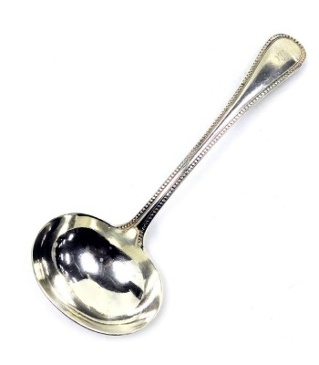 A Victorian silver cream ladle, initial engraved, London 1873, 2.40oz.