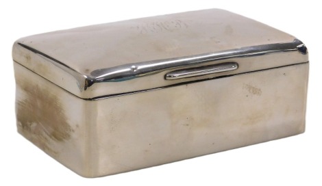 A George V silver cigarette box, of twin division form, monogram engraved, Birmingham 1922, 15.40oz all in, 14cm wide.