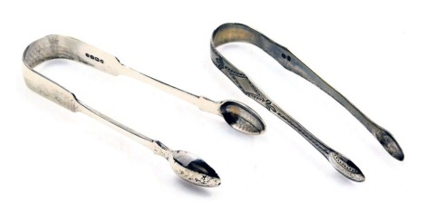 A pair of Georgian silver sugar tongs, with bright cut engraving, and a pair of Victorian silver sugar tongs, of plain form, London 1868, 2.45oz.