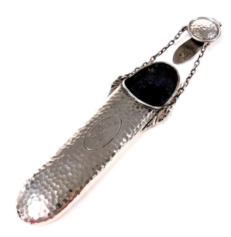 An Edward VII silver chatelaine spectacles case, with chain and clip suspension, with engine turned decoration, oval reserve, monogram engraved, Birmingham 1903, 2.21oz.