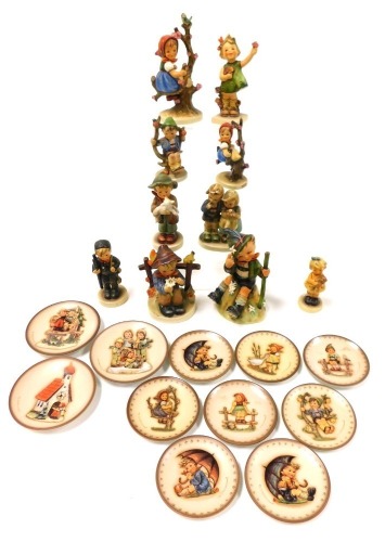 A group of Hummel figures, including Apple Tree Girl, Mountaineer and Chimney Sweep, together with eleven Hummel plates. (qty)