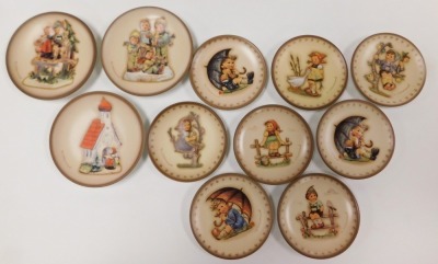 A group of Hummel figures, including Apple Tree Girl, Mountaineer and Chimney Sweep, together with eleven Hummel plates. (qty) - 3