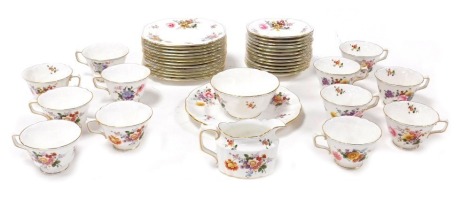 A Royal Crown Derby porcelain Derby Posies pattern tea service, comprising cream jug, sugar bowl, bread plate, twelve tea cups, saucers and tea plates.