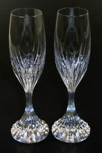 A pair of Baccarat Massena crystal champagne flutes, etched marks, 22cm high.