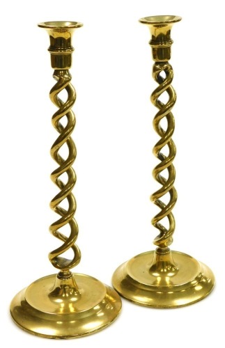 A pair of 19thC barley twist brass candlesticks, 33cm high.