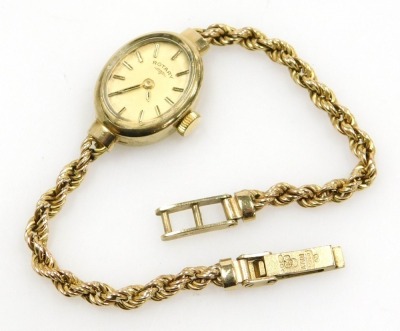 A Rotary lady's 9ct gold cased wristwatch, oval champagne dial with gilt batons, in an oval casing, on a 9ct gold rope twist strap, 14.5g all in. - 2