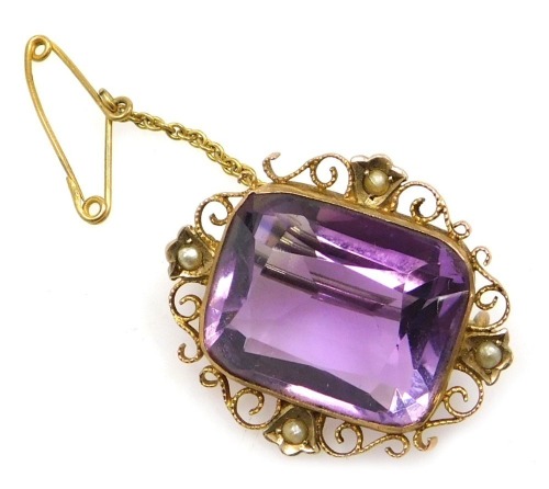 An amethyst and seed pearl brooch, set in a yellow metal filigree mount, stamped 9ct, with safety chain as fitted, 7.4g.