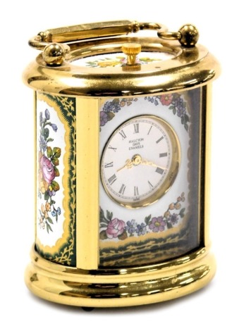 A Halcyon Days brass and enamel table clock, decorated with floral panels, 8.5cm high.