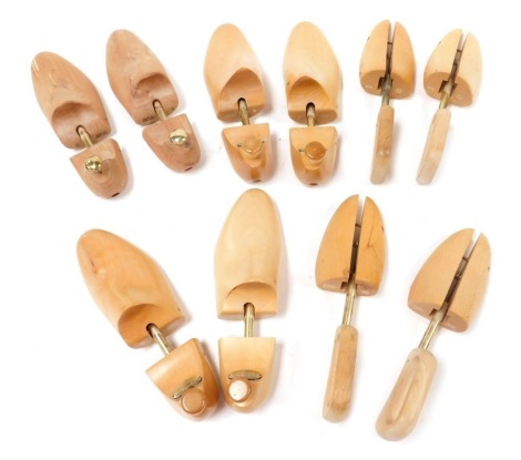 Four pairs of Church's wooden shoe stays, and a pair of unmarked wooden shoe stays.