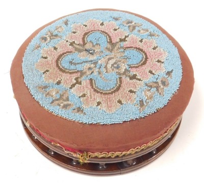 A Victorian mahogany and beadwork upholstered footstool, 30.5cm diameter. - 2