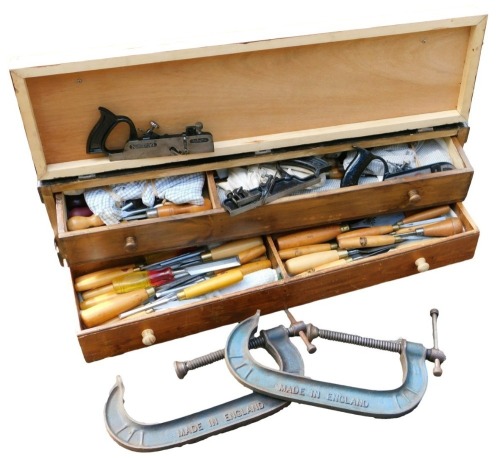 A carpenter's pine tool chest, the hinged front opening to reveal two drawers, enclosing tools, 87cm wide, and a pair of Record 120-10 heavy duty clamps. (3)