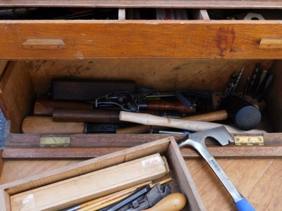 A carpenter's tool chest, the drop front opening to reveal three drawers and a recess, enclosing various tools, 63cm wide. - 3