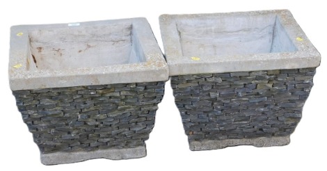 A pair of concrete square planters, with textured sides, 33cm high, 45cm wide, 45cm deep.