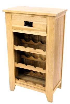 A light oak kitchen wine rack, with a frieze drawer above three section rack, on stiles, 101cm high, 50cm wide.