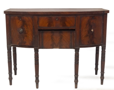 A George III mahogany bowfront sideboard, with cellaret drawer, central frieze drawer and concealed drawer, with ebonised ring turned legs, 92cm high, 122cm wide, 54cm deep. - 2