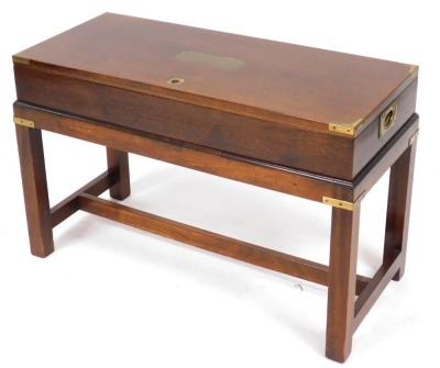 A mahogany cased Dynatron radiogram, with a Dynotron radio and stereophonic tuner amplifier SRX 29C, and a Garrard SP25 MKIV turntable, the box casing raised on square legs united by a H stretcher. - 2