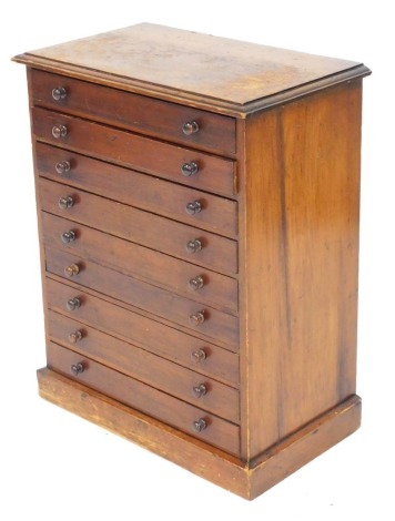 A Victorian mahogany finish pine collector's chest, of nine drawers, raised on a plinth base, 63cm high, 50cm wide, 29cm deep.