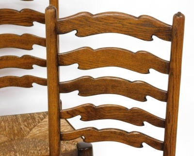 A set of four Titchmarsh & Goodwin oak rush seated ladder back single dining chairs. - 3