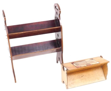 A Victorian mahogany book trough, with two troughs, with brass studded carved side supports, 69cm high, 49.5cm wide, 22.5cm deep, together with an oak table top book trough, 41cm wide. (2)