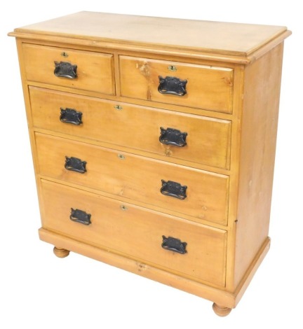 A Victorian pine chest of two short over three long graduated drawers, raised on a plinth base, on bun feet, 119cm high, 106cm wide, 50cm deep.