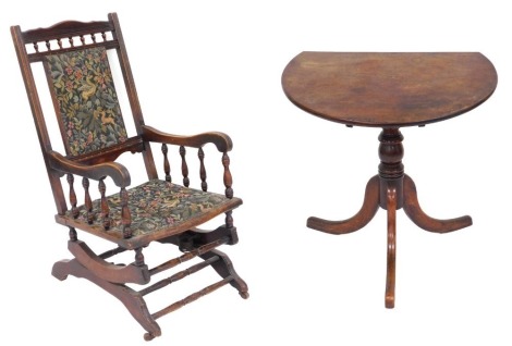 A Victorian American style beech rocking chair, with upholstered seat and back, raised on castors, 56cm wide, together with a Georgian mahogany and oak occasional table, raised on a turned column over three cabriole legs, 69cm high, 75cm wide. (2, AF)