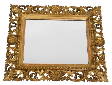 A rococo style giltwood rectangular wall mirror, with shell and foliate carving, and rectangular glass plate, 62cm x 70cm.