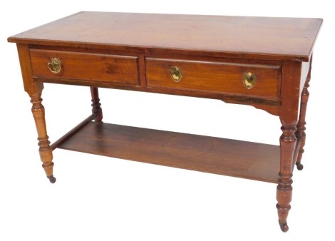 A Victorian mahogany dressing table base, with two frieze drawers, raised on turned legs, united by an under tier, capped on castors, 74cm high, 122cm wide, 58.5cm deep.