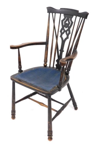 A Victorian ebonised beech kitchen chair, with a carved splat and spindle back, raised on turned legs united by a H frame stretcher, 60cm wide,