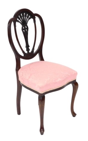 A Hepplewhite style mahogany chair, with a carved back, overstuffed seat in pink floral fabric, on carbiole legs.