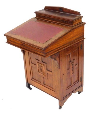 A Victorian mahogany and burr maple davenport, the box top with a fitted interior, the hinged lid inlaid with gilt tooled red leatherette, opening to reveal an interior with two drawers, the base with a cupboard door enclosing four frieze drawers, raised 