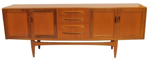 A G-Plan teak sideboard, the rectangular top above four central drawers flanked by two pairs of cupboards, on tapering legs with stretcher, bearing stamp, 79cm high, 212cm wide, 46cm deep.