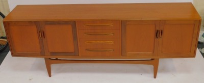 A G-Plan teak sideboard, the rectangular top above four central drawers flanked by two pairs of cupboards, on tapering legs with stretcher, bearing stamp, 79cm high, 212cm wide, 46cm deep. - 2