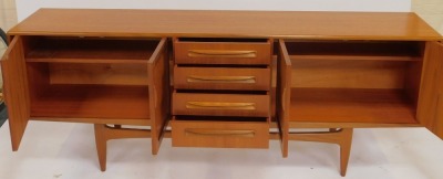 A G-Plan teak sideboard, the rectangular top above four central drawers flanked by two pairs of cupboards, on tapering legs with stretcher, bearing stamp, 79cm high, 212cm wide, 46cm deep. - 3