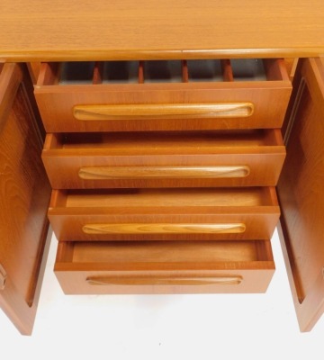 A G-Plan teak sideboard, the rectangular top above four central drawers flanked by two pairs of cupboards, on tapering legs with stretcher, bearing stamp, 79cm high, 212cm wide, 46cm deep. - 4