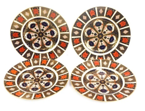 Four Royal Crown Derby porcelain plates decorated in the Old Imari pattern, 1128, red printed marks, 27cm diameter.