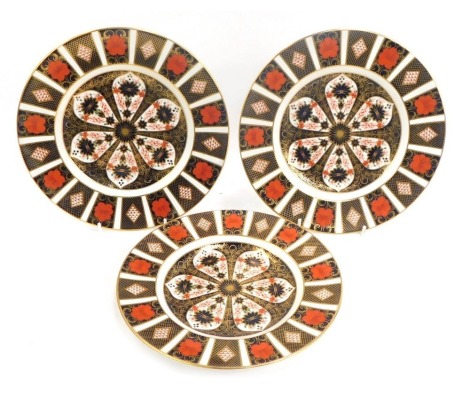 Three Royal Crown Derby porcelain plates decorated in the Old Imari pattern, 1128, red printed marks, 23cm diameter.