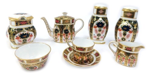 A group of Royal Crown Derby Old Imari pattern porcelain, comprising miniature tea service, teapot, 8cm high (AF), milk jug, teacup and saucer, and sugar bowl, together with a preserve pot and cover, 8cm high, and a pair of salt and pepper shakers, 9.5cm