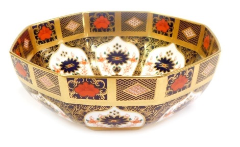 A Royal Crown Derby porcelain bowl decorated in the Old Imari pattern, of octagonal form, gold ground, red printed marks, 21cm diameter.