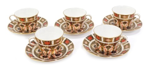 A set of five Royal Crown Derby porcelain teacups and saucers decorated in the Old Imari pattern, 1128, red printed marks.