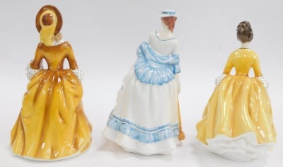 Three Royal Doulton porcelain figures, modelled as Sandra HN2275, Coralie HN2307 and Summertime HN3137. - 2